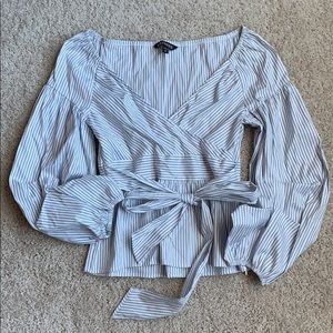 Women’s blouse, bow can be tied front or back.